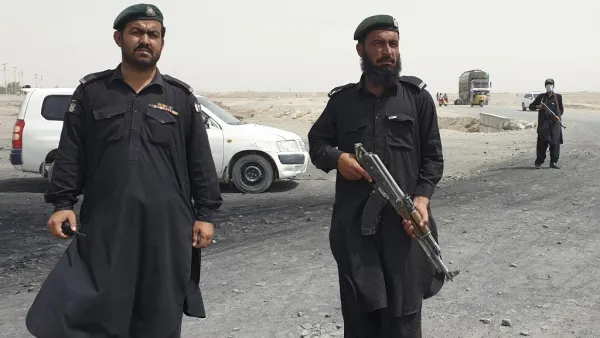 Frontier constabulary personnel stand guard in the border town of Chaman on July 16, 2021, following clashes between Afghan forces and Taliban fighters in Spin Boldak to retake the key border crossing with Pakistan