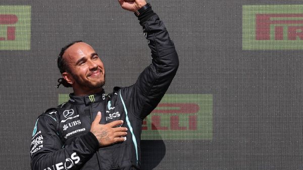 Race winner Mercedes' British driver Lewis Hamilton celebrates on the podium after the Formula One British Grand Prix motor race at Silverstone motor racing circuit in Silverstone, central England on July 18, 2021. (Photo: AFP)