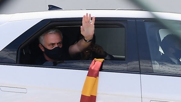 Portuguese football coach Jose Mourinho waves from a car upon his arrival at Rome's Ciampino airport on July 2, 2021. (Photo: AFP)