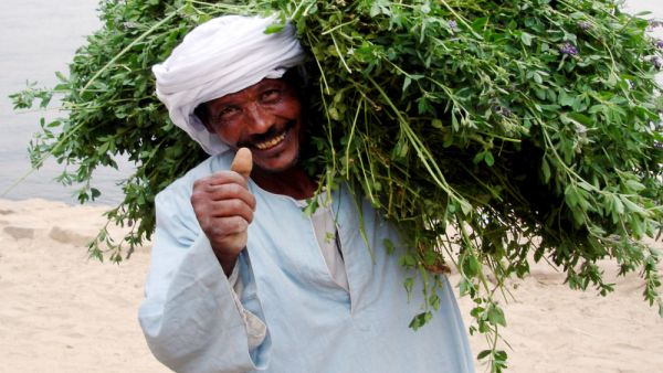 :Nubian man smiling with his thumbs
