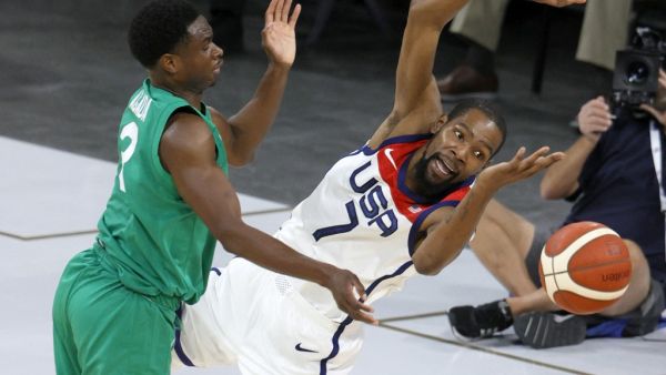 Caleb Agada #3 of Nigeria fouls Kevin Durant #7 of the United States during an exhibition game at Michelob ULTRA Arena ahead of the Tokyo Olympic Games on July 10, 2021 in Las Vegas, Nevada. Nigeria defeated the United States 90-87. (Photo: AFP)