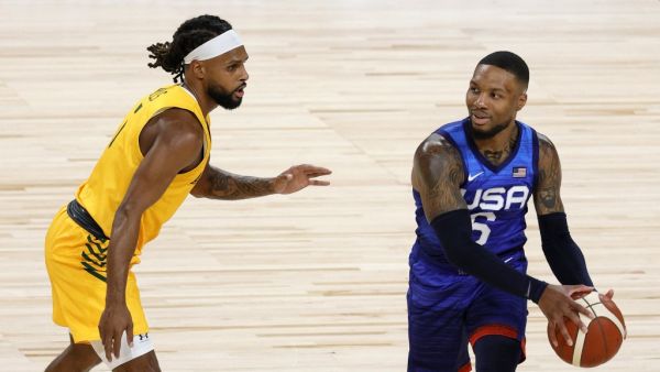 Damian Lillard #6 of the United States is guarded by Patty Mills #5 of the Australia Boomers during an exhibition game at Michelob Ultra Arena ahead of the Tokyo Olympic Games on July 12, 2021 in Las Vegas, Nevada. Australia defeated the United States 91-83. (Photo: AFP)