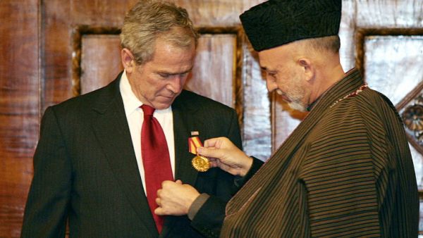 Taliban leader, former Afghan president discuss new government