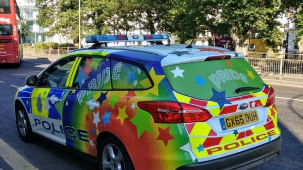 Police car decorated with pride flag to decrease hate crimes