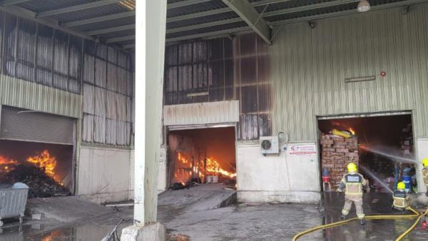 plastic materials warehouse  catches fire