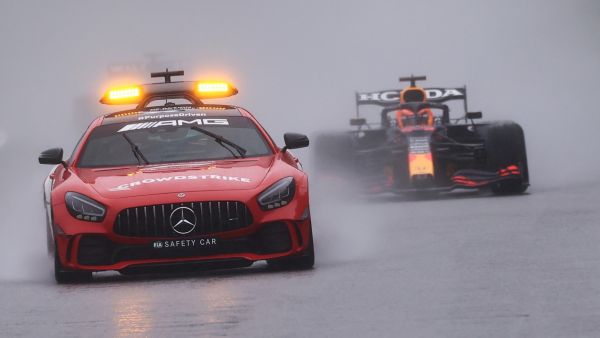 Red Bull's Dutch driver Max Verstappen (R) drives behind the safety car during preliminary laps as the race is postponed over rainy weather during the Formula One Belgian Grand Prix at the Spa-Francorchamps circuit in Spa on August 29, 2021. (Photo: AFP)