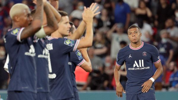 Paris Saint-Germain's players celebrate next to Paris Saint-Germain's French forward Kylian Mbappe (R) after winning the French L1 football match between Paris Saint-Germain and Racing Club Strasbourg at the Parc des Princes stadium in Paris on August 14, 2021. (Photo: AFP)