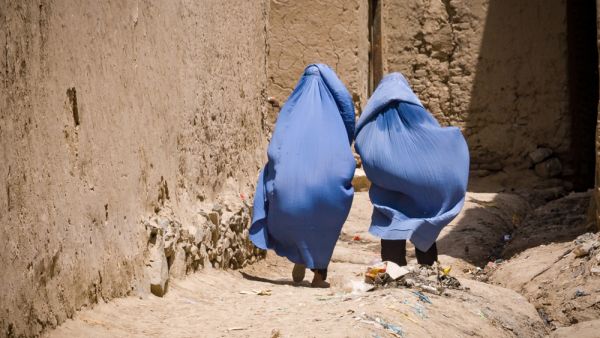 Women in burqas walking home in Kabul, Afghanistan