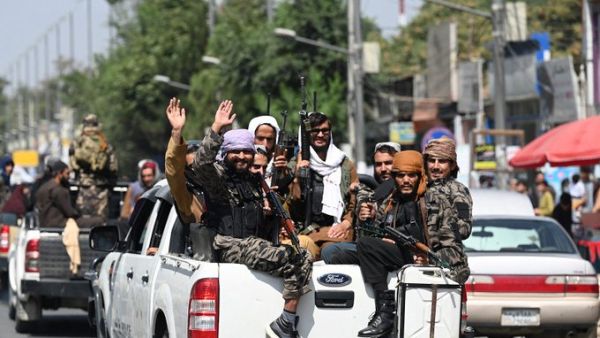 Taliban fighters manned checkpoints around Kabul as work got underway to form a new government in Afghanistan