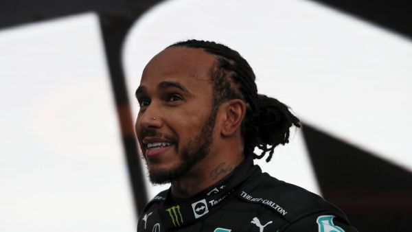 Mercedes' British driver Lewis Hamilton celebrates after winning the Formula One Russian Grand Prix at the Sochi Autodrom circuit in Sochi on September 26, 2021. (Photo: AFP)