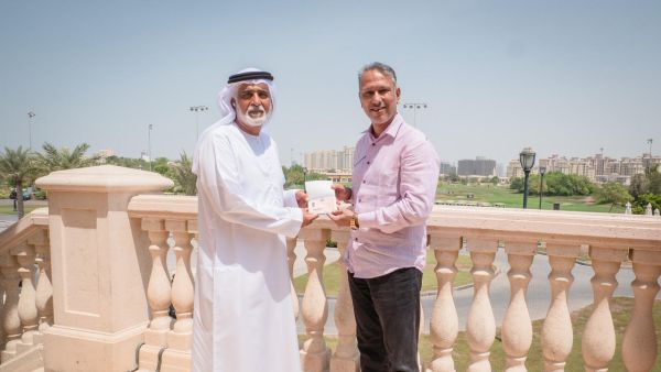 Ismail Sharif, Managing Director of Jumeirah Golf Estates presents Jeev Milkha Singh with his Golden Visa (Photo: Supplied)