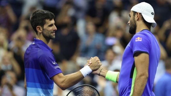 (L-R) Novak Djokovic of Serbia shakes hands with Matteo Berrettini of Italy at center court after Djokovic won their Men's Singles quarterfinal match on Day Ten of the 2021 US Open at the USTA Billie Jean King National Tennis Center on September 08, 2021 in the Flushing neighborhood of the Queens borough of New York City. (Photo: AFP)