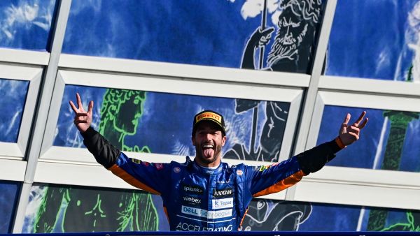 Winner McLaren's Australian driver Daniel Ricciardo celebrates on the podium after the Italian Formula One Grand Prix at the Autodromo Nazionale circuit in Monza, on September 12, 2021. (Photo: AFP)