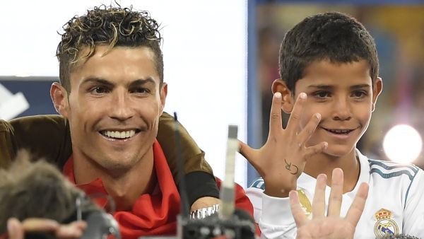Cristiano Ronaldo celebrates with his son Cristiano junior after winning the UEFA Champions League final football match between Liverpool and Real Madrid at the Olympic Stadium in Kiev, Ukraine on May 26, 2018. (Photo: AFP)