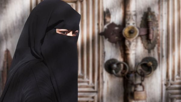 Portrait of a Middle Eastern woman wearing a black Niqab