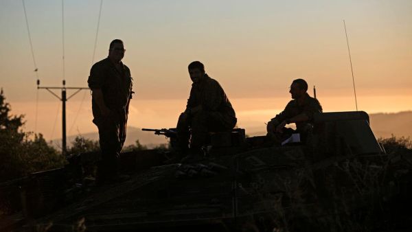 Israeli soldiers looking towards Lebanon 
