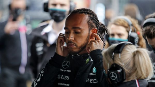 Mercedes' British driver Lewis Hamilton gets ready with his team prior to the start of the Formula One Grand Prix of Turkey at the Intercity Istanbul Park in Istanbul on October 10, 2021. (Photo: UMIT BEKTAS / POOL / AFP)