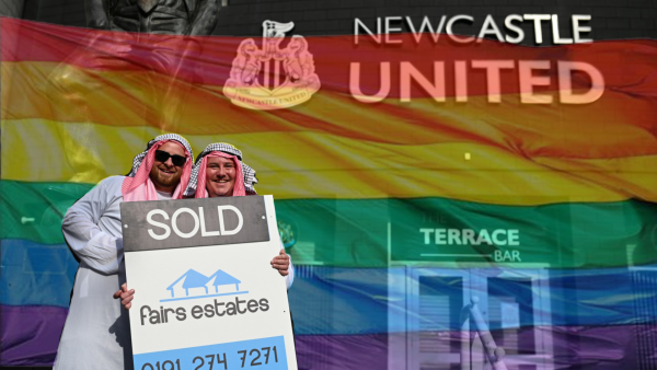 Newcastle fans celebrating Saudi deal