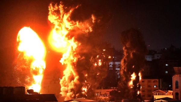 Fire and smoke rise above buildings in Gaza City from Israeli warplanes