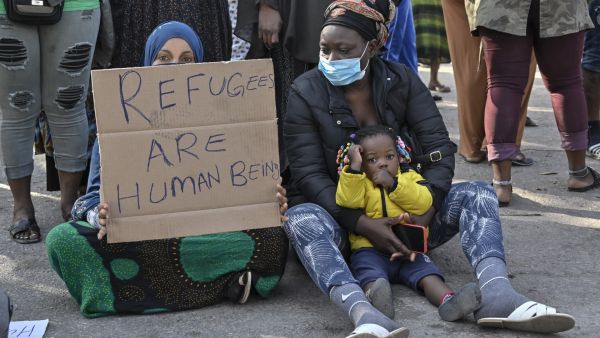 Greece imposes charges against Two dozen humanitarian activists, who helped refugees reach the country.