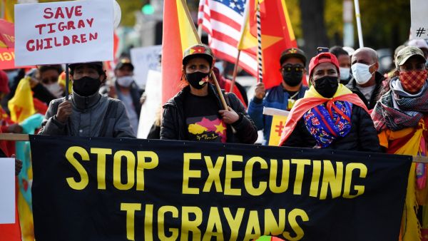 Demonstrators march in Washington, DC on November 4, 2021, marking the one-year anniversary of the Ethiopian government's decision to deploy troops into the country's northernmost Tigray region. (Photo by Olivier DOULIERY / AFP) Tigray rebels slam Ethiopian prime minister's vow to fight in the front line
