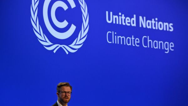 A draft text at the COP26 climate summit urged countries on Wednesday to boost their emissions cutting goals by 2022, three years ahead of schedule, after data showed the world was far off track to limit warming to 1.5C. (Photo by ANDY BUCHANAN / AFP) COP26 presidency releases draft deal amid final Glasgow meeting