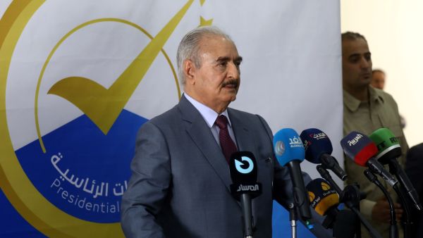 Libya's eastern military chief Khalifa Haftar gives a speech at the local headquarters of the High National Election Commission in the eastern city of Benghazi on November 16, 2021. Libya Parliamentary Elections