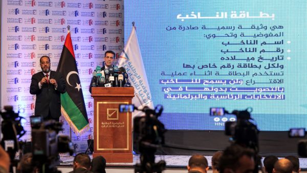 Imad al-Sayeh (R), the head of Libya's High National Electoral Commission, gives a press conference in the capital Tripoli on November 23, 2021. (Photo by Mahmud Turkia / AFP) Failure to hold Libya's December elections could lead to more conflict