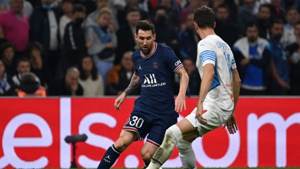 Paris Saint-Germain's Argentinian forward Lionel Messi runs with the ball next to Marseille's Brazilian defender Luan Peres during the French L1 football match between Olympique Marseille (OM) and Paris Saint-Germain's (PSG) at Stade Velodrome in Marseille, southern France, on October 24, 2021. (Photo: AFP)