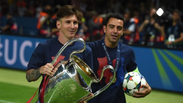 Xavi Hernandez (R) and Lionel Messi (Photo: AFP)