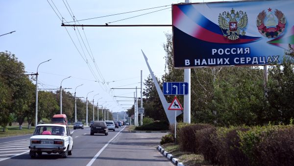 A billboard reading "Russia in our hearts" sits on the side of a road in the town of Tiraspol, the capital of Transnistria - Moldova's pro-Russian breakaway region on the eastern border with Ukraine, on September 11, 2021. (Photo by Sergei GAPON / AFP) Putin once described the collapse of the Soviet Union, the predecessor state of Moscow, as "the greatest geopolitical catastrophe of the century".
