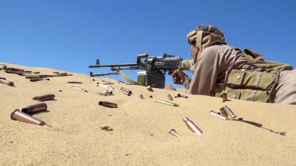 A Yemeni pro-government fighter takes aim from his position during fighting with Huthi rebels on the al-Jawba frontline south of Marib, the last remaining government stronghold in northern Yemen, on December 7, 2021. (Photo by AFP) Saudi air defenses destroyed two Houthi drones