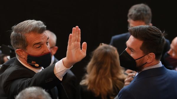 Barcelona's president Joan Laporta (L) greets Barcelona's Argentinian forward Lionel Messi as he arrives to attend his official inauguration at the Camp Nou stadium in Barcelona on March 17, 2021. (Photo: AFP)