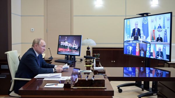 Russian President Vladimir Putin attends a video emergency meeting of the Council of the Collective Security Treaty Organization (CSTO) focused on the situation in Kazakhstan in the wake of violent protests, at the Novo-Ogaryovo state residence, outside Moscow, on January 10, 2022. (Photo by Alexey NIKOLSKY / SPUTNIK / AFP) Russian citizens are evacuated from Kazakhstan on military planes following uprising
