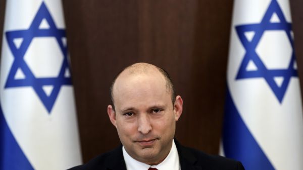 Israeli Prime Minister Naftali Bennett poses for a picture during the weekly cabinet meeting in Jerusalem on July 11, 2021. (Photo by RONEN ZVULUN / POOL / AFP) Israeli Prime Minister Naftali Bennett