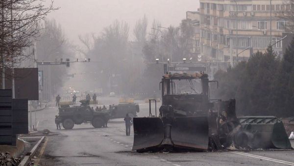 Servicemen and their military vehicles block a street in central Almaty on January 7, 2022, after violence that erupted following protests over hikes in fuel prices. (Photo by Abduaziz MADYAROV / AFP) Kazakhstan protests