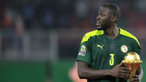 Senegal's defender Kalidou Koulibaly holds the trophy prior to the ceremony after winning after the Africa Cup of Nations (CAN) 2021 final football match between Senegal and Egypt at Stade d'Olembe in Yaounde on February 6, 2022. (Photo by Kenzo TRIBOUILLARD / AFP)