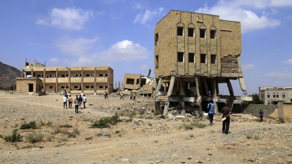 Yemeni students walk past the debris of a school, that was damaged last year following a Saudi-led coalition air strike against Shiite Huthi, as they make their way to their class in the country's third-city of Taez, on March 6, 2019. / AFP/ File Photo Yemeni students flee Ukraine war