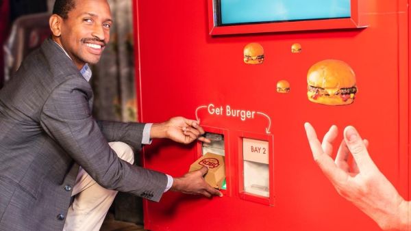 The front of the vending machine features a touchscreen, where customers can select their toppings and condiments