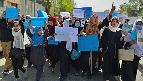 Afghan women and girls take part in a protest in front of the Ministry of Education in Kabul on March 26, 2022, demanding that high schools be reopened for girls. (Photo by Ahmad SAHEL ARMAN / AFP) The Taliban reopened secondary schools on Wednesday after winter break but broke a promise to allow girls above sixth grade to return to classrooms.