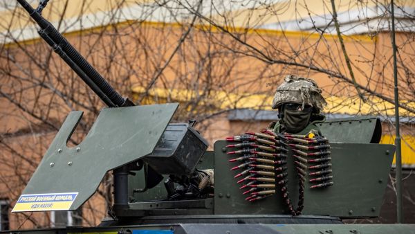 A Ukrainian soldier sits in an armored car in the suburbs of Kyiv, on March 26, 2022, during Russia's military invasion launched on Ukraine. (Photo by FADEL SENNA / AFP) Joe Biden and other NATO leaders previously ruled out the possibility of the Western alliance's direct involvement in the conflict.
