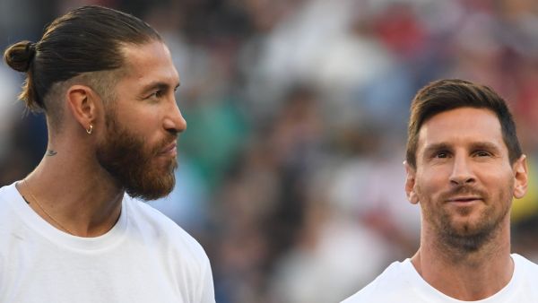 Paris Saint-Germain's Spanish defender Sergio Ramos (L) and Paris Saint-Germain's Argentinian forward Lionel Messi pose during a presentation ceremony prior to the French L1 football match between Paris Saint-Germain and Racing Club Strasbourg at the Parc des Princes stadium in Paris on August 14, 2021. (Photo by Bertrand GUAY / AFP)