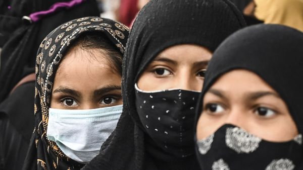 Muslim women take part in a protest against the recent hijab ban 