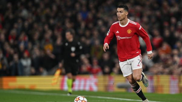 Manchester United's Portuguese striker Cristiano Ronaldo runs with the ball during the UEFA Champions League round of 16 second leg football match between Manchester United and Atletico Madrid at Old Trafford stadium in Manchester, north west England on March 15, 2022. (Photo by Paul ELLIS / AFP)