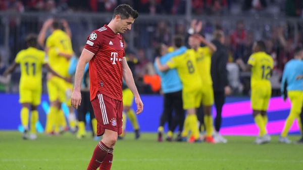 Bayern Munich's Polish forward Robert Lewandowski reacts after the UEFA Champions League quarter-final, second leg football match FC Bayern Munich v FC Villarreal in Munich, southern Germany on April 12, 2022. (Photo by Jose Jordan / AFP)