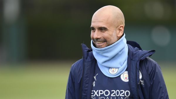Manchester City's Spanish manager Pep Guardiola reacts as he arrives to lead a training session at the Manchester City training ground in Manchester, north west England, on April 25, 2022, on the eve of their UEFA Champions League semi-final first leg football match against Real Madrid. (Photo by Oli SCARFF / AFP)