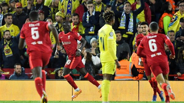 Liverpool's Senegalese striker Sadio Mane celebrates after scoring his team second goal during the UEFA Champions League semi-final first leg football match between Liverpool and Villarreal, at the Anfield Stadium, in Liverpool, on April 27, 2022. (Photo by Oli SCARFF / AFP)