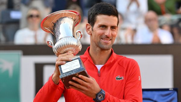 Serbia's Novak Djokovic holds the winner's trophy after winning the final match of the Men's ATP Rome Open tennis tournament against Greece's Stefanos Tsitsipas on May 15, 2022 at Foro Italico in Rome. (Photo by Andreas SOLARO / AFP)