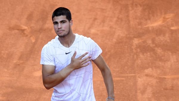 Spain's Carlos Alcaraz celebrates after beating Spain's Rafael Nadal during their 2022 ATP Tour Madrid Open tennis tournament singles quarter-final match at the Caja Magica in Madrid on May 6, 2022. (Photo by OSCAR DEL POZO / AFP)