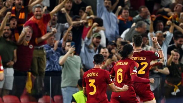 Roma's Italian midfielder Nicolo Zaniolo (R) celebrates with teammates after scoring the team's first goal during the UEFA Europa Conference League final football match between AS Roma and Feyenoord at the Air Albania Stadium in Tirana on May 25, 2022. (Photo by OZAN KOSE / AFP)